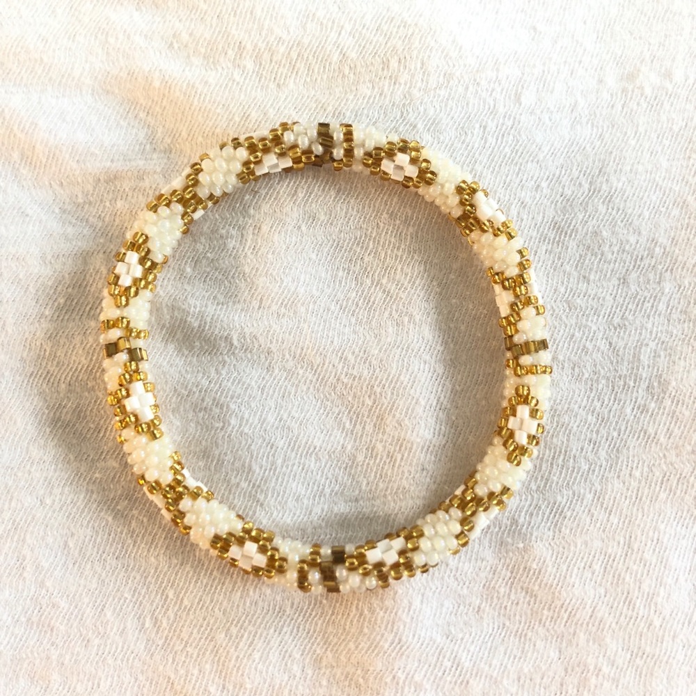 gold and white beaded bracelet